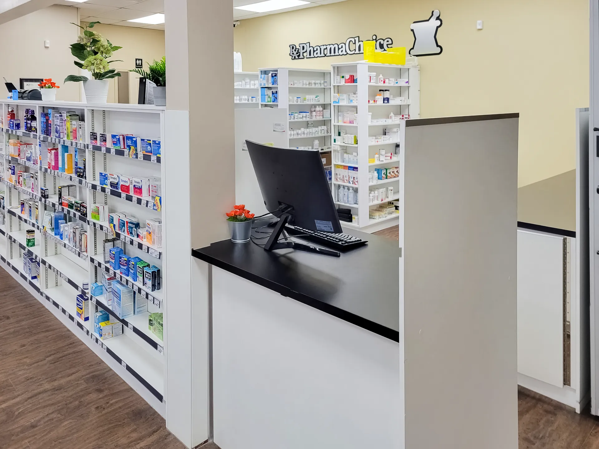 Finished pharmacy with stocked shelving, till counter, and dispensary behind
